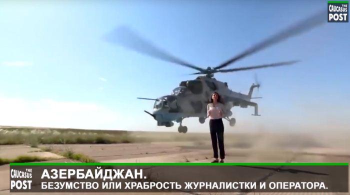 Jurnalis wanita Rusia di dekat heli Mi-24 Azerbaijan Jurnalis wanita Rusia di dekat heli Mi-24 Azerbaijan
